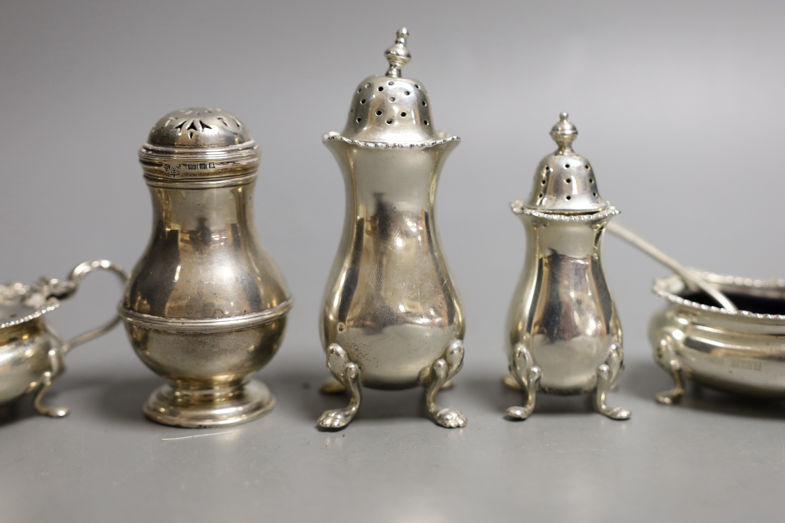 Seven assorted 20th century silver condiments including pepperettes and mustards.